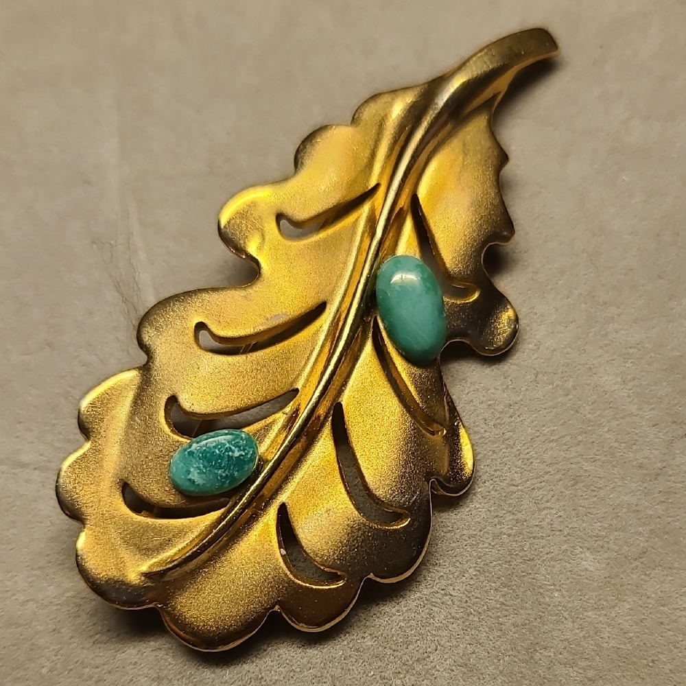 Gold Colored Leaf Brooch with Green  Accents